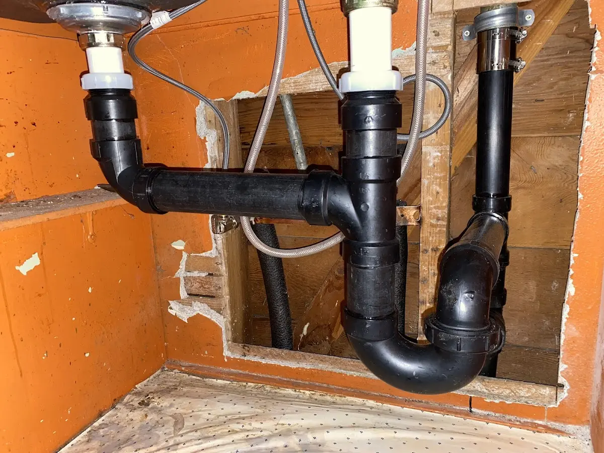 Professional Garbage Disposal Repair equipment and tools on the job in Maynard